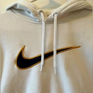 Nike Sweatshirt with black swoosh symbol outlined in gold
